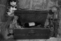  Old wooden box with bottle of wine