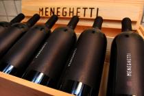 Meneghetti, bottles of wine in a wooden box